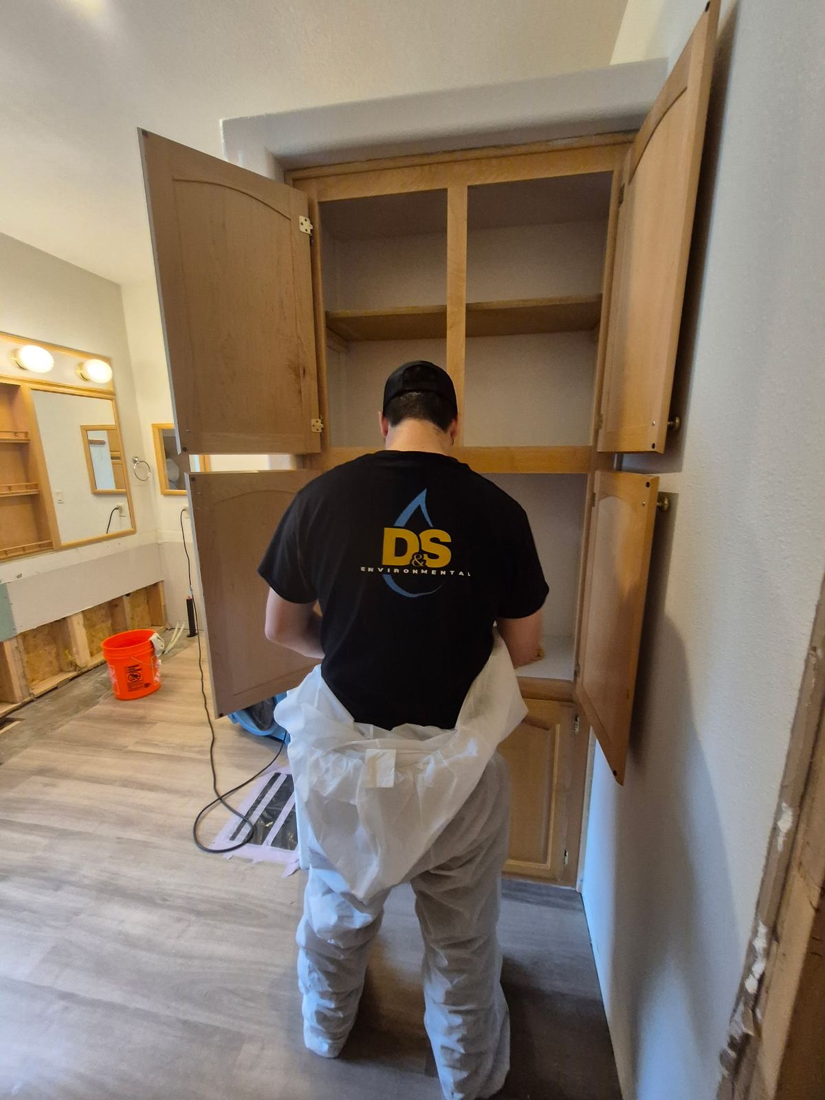 Technician assessing an interior space